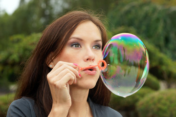 Woman blows bubble