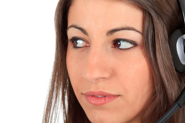 Obraz premium Thoughtful call center girl with headphones