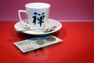 Tip on a red glass table