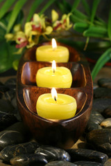 Obraz na płótnie Canvas Spa candles with rocks for aromatherpy