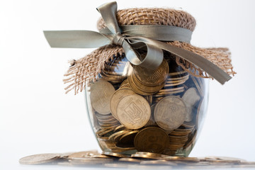 Glass jar with coins