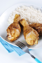 Roasted chicken legs with boiled rice