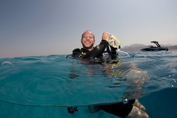 scuba diver on surface