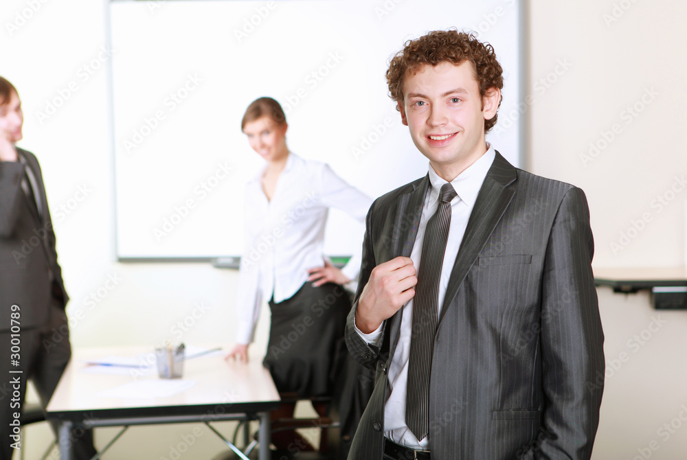 Wall mural young business man in office