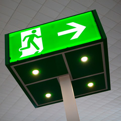 green emergency exit sign