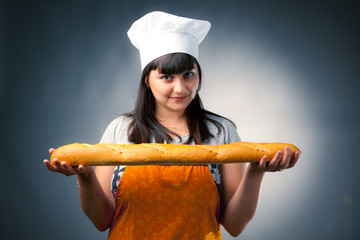 woman cook holding fresh baked bread