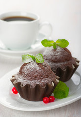 Chocolate muffins and a cup of coffee