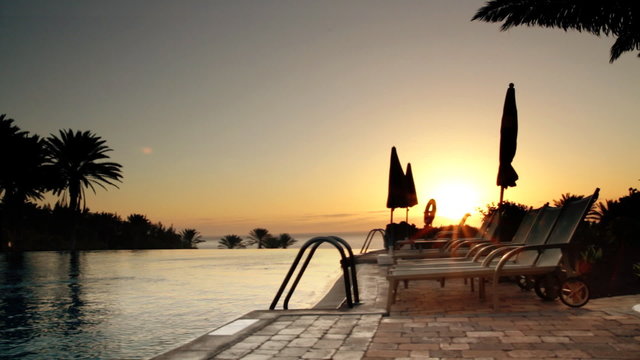 Sunbeds by the infinity pool at the sunrise