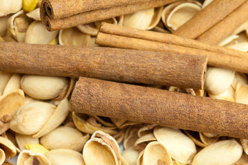 background from the shell of pistachio nuts and cinnamon sticks