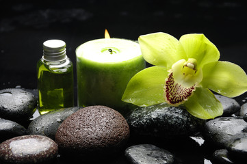 Oriental spa with orchid , candle and pebbles