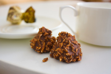 chocolate candy with nuts and tea