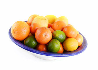 Bowl of citrus fruit - orange, lime, lemon