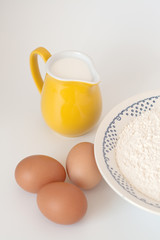 Pitcher of milk, eggs and flour