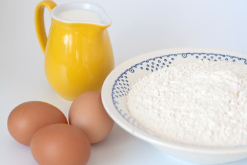 Pitcher of milk, eggs and flour