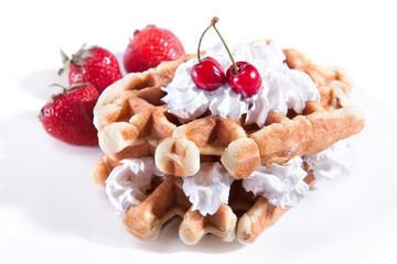 Waffle with strawberry and cherry and vanilla cream