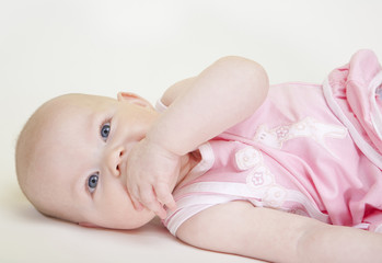 portrait of lying down baby girl