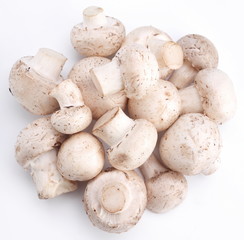 Handful of champignons on a white background