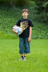 boy with ball - obrazy, fototapety, plakaty