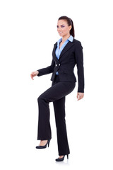 business woman stepping on imaginary step