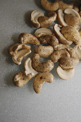 image of cashews covered in sea salt and cracked black pepper