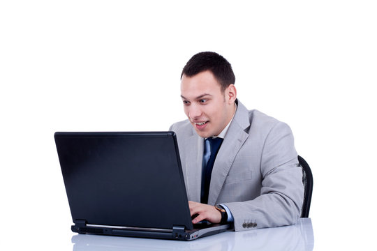 amased business man at his laptop