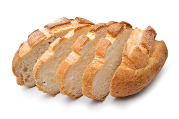 Traditional homemade round bread, sliced, isolated on a white ba