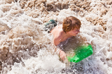 boy has fun with the surfboard