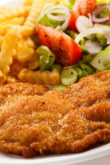 Pork chop, French fries and vegetables