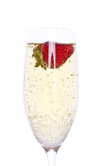 fresh strawberry in glass of champagne