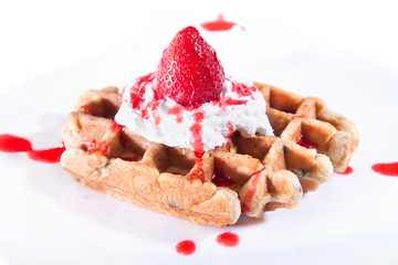 Waffle with vanilla cream and strawberry