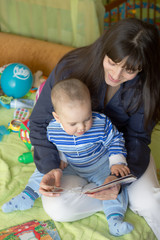 Mom and the little boy reading a book