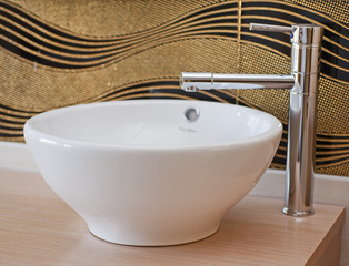 Bathroom washbasin and tap