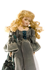 antique doll in silk dress isolated on white background