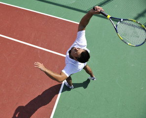 young man play tennis outdoor