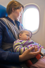 Mother and baby on aeroplane
