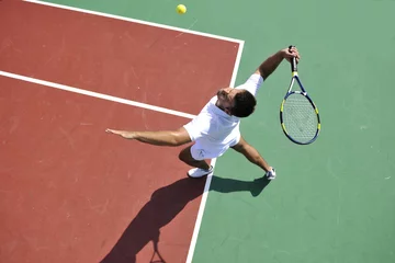 Fotobehang young man play tennis outdoor © .shock