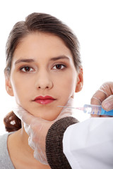 Plastic surgeons giving botox injection