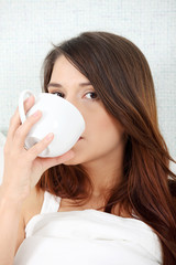 Cute woman drinking a coffee