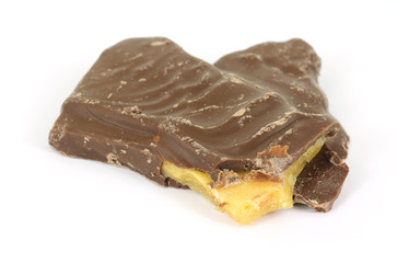 Bitten chocolate covered peanut brittle