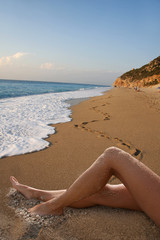 beautiful woman legs on the beach
