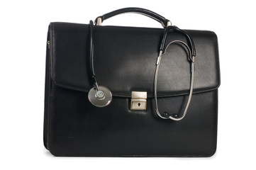 Black portfolio and phonendoscope on white background