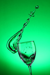 Water splashes out of water glass
