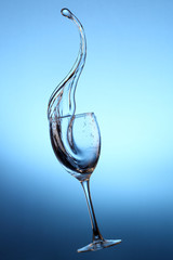 Water splashes out of water glass