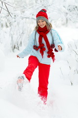 Fototapeta na wymiar young playful woman outdoor in winter