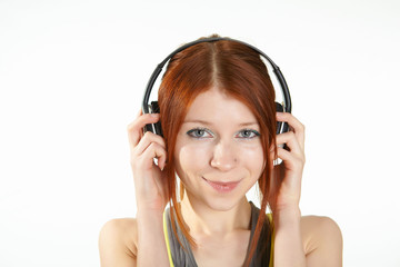 Naklejka premium a teenage girl in studio with headphones