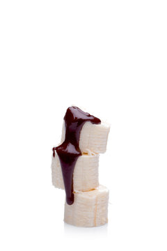 Banana slices with melted chocolate over them