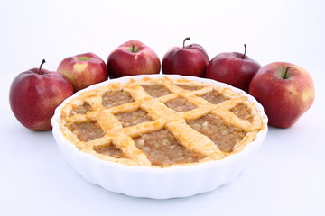 Apple Pie and some red apples on white background