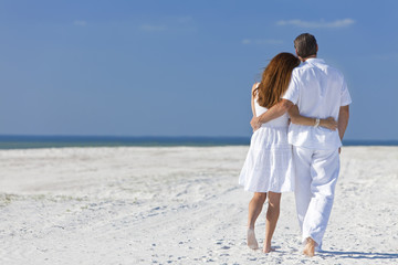 Couple Walking on An Empty Beach