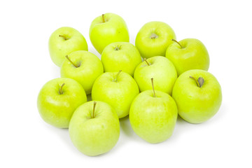 Green and yellow apples on a white baclground
