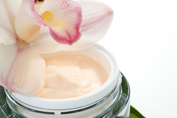 Face cream and orchid flower